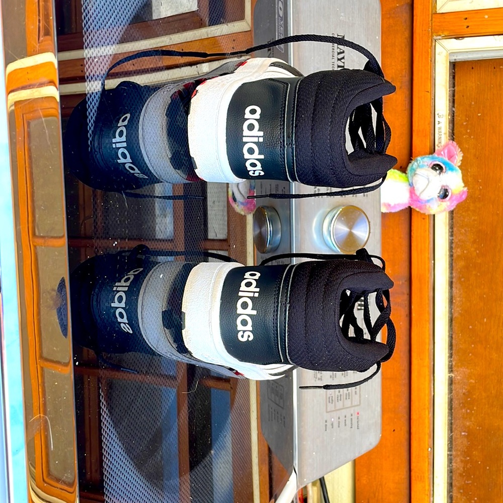 Black Adidas high tops.